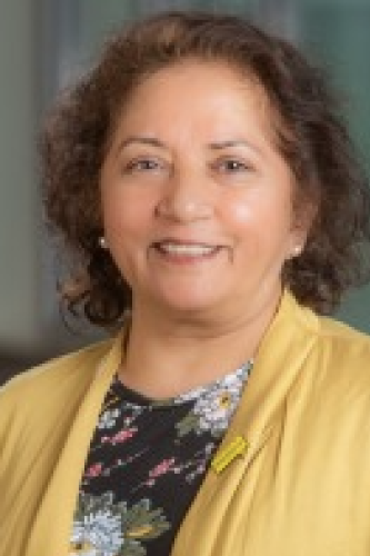 Portrait of Fizza Gillani in a yellow cardigan