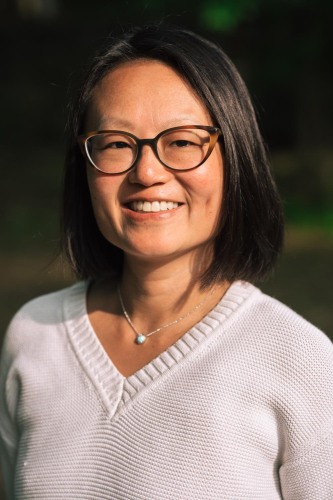 Silvia Chiang in a white sweater