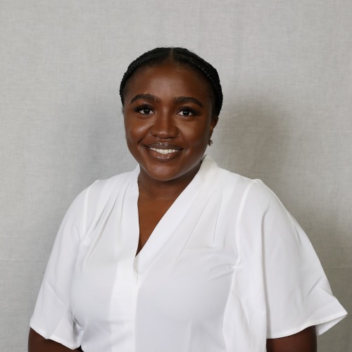 Dr. Odinaka Anyanwum in a white blouse
