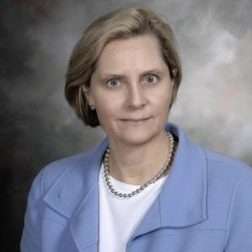 Portrait of Dr. Julia Katarincic in a white shirt with a blue jacket
