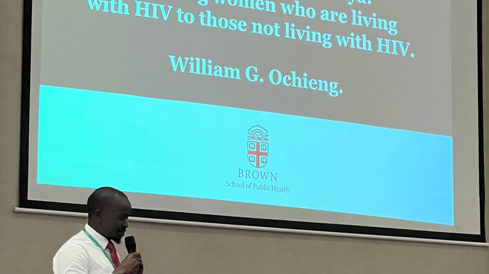 William G. Ochieng presenting a powerpoint on the survival outcomes of cervical cancer among women with and without HIV in Western Kenya.