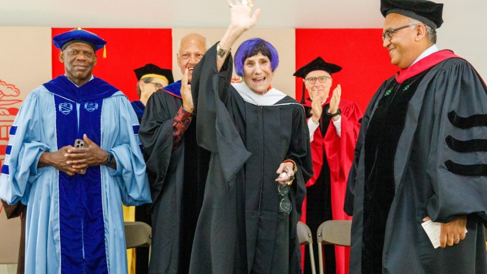 Congresswoman Rosa DeLauro waves at the audience at the School of Public Health graduation