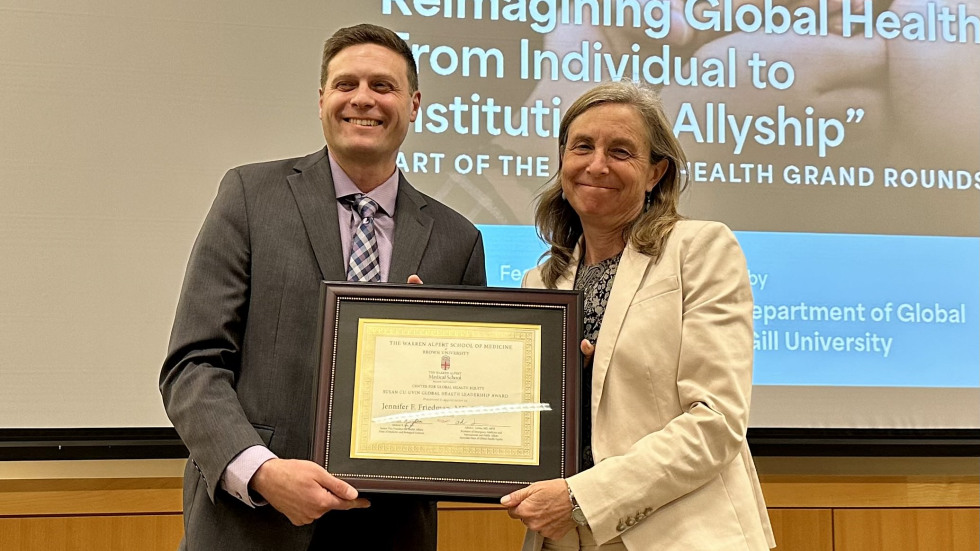 Dr. Adam Levine presenting the Susan Cu-Uvin Global Health Leadership Award to Dr. Jennifer Friedman in 2025. 